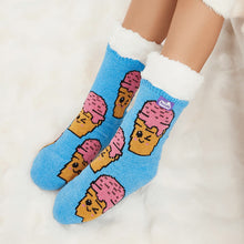 Load image into Gallery viewer, The Foozie™ Ice Cream slipper socks, smiling ice cream cone print on blue, worn on a fluffy white rug